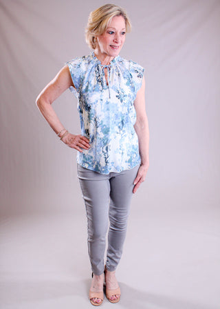 Staccato Tie Neck Sleeveless Top modeled view - Fashion Crossroads Inc.
