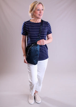 Staccato Short Sleeve Top with Shoulder Buttons modeled view - Fashion Crossroads Inc.