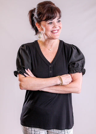 Staccato Short Sleeve V Neck Top with Snaps front view - Fashion Crossroads Inc.