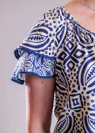 Tribal Sportswear Flutter Sleeve Blouse with Tie Neck detail view - Fashion Crossroads Inc