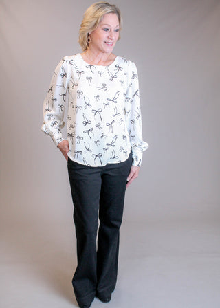 Blu Pepper Long Sleeve Blouse with Bow Print Model View - Fashion Crossroads Inc