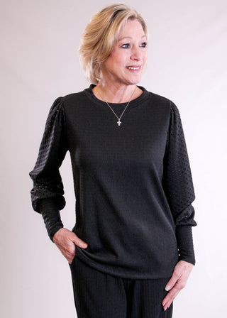 Staccato Crew Neck Top with Eyelet Sleeves front view - Fashion Crossroads Inc