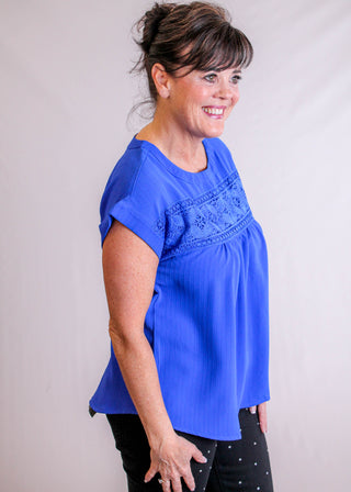 Blu Pepper Top with Eyelet Lace and Back Buttons side view - Fashion Crossroads Inc.