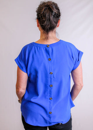 Blu Pepper Top with Eyelet Lace and Back Buttons back view - Fashion Crossroads Inc.