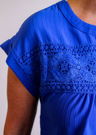 Blu Pepper Top with Eyelet Lace and Back Buttons detail view - Fashion Crossroads Inc.