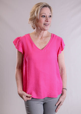 MINE V Neck Blouse with Embroidered Back front view- Fashion Crossroads Inc