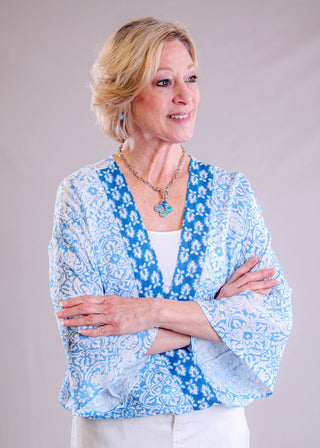 Charlie B 3/4 Sleeve Printed Blouse with Cross Front front view - Fashion Crossroads Inc.