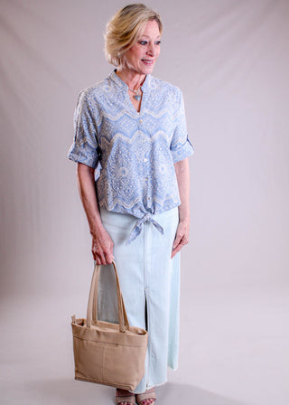 Charlie B Embroidered Eyelet Top with Tie Front modeled view - Fashion Crossroads Inc.