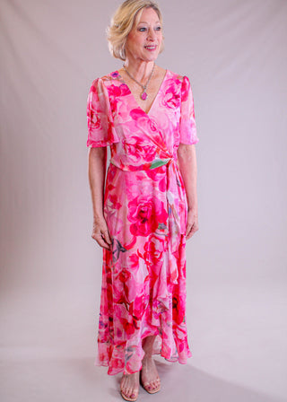 Maggie London Floral High-Low Dress with Tie Waist modeled view - Fashion Crossroads Inc.
