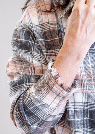 Tribal Sportswear Long Sleeve Plaid Shirt with Fringe Hem sleeve view - Fashion Crossroads Inc.