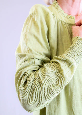 Tribal Sportswear Notch Neck Blouse with Jaquard Applique Sleeve detail view - Fashion Crossroads