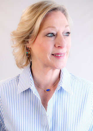 Kendra Scott Elisa Gold Pendant with Indigo Kyocera Opal modeled view- Fashion Crossroads Inc