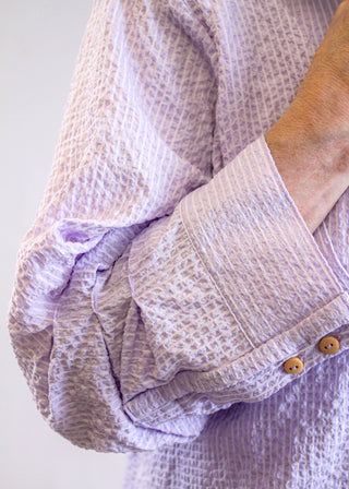 Democracy Bubble Hem Top sleeve view - Fashion Crossroads Inc.