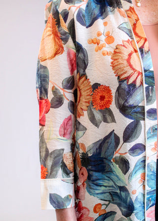 Adore Clothing Floral Print Crepe Tunic Blouse in Cream Multi detail view - Fashion Crossroads Inc.