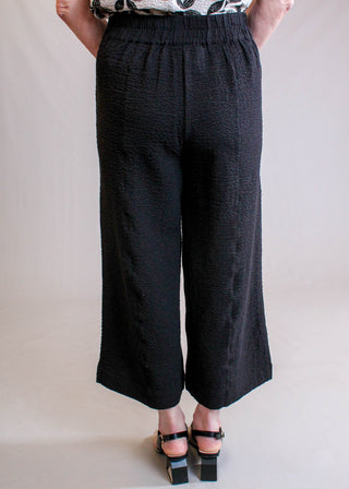 Habitat Crinkle Crepe Aria Wide Leg Crop Pant in Black back view - Fashion Crossroads Inc.