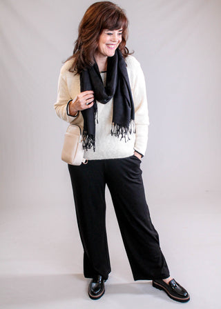 Habitat Core Travel Knit Pleated Wide Leg Pant in Black styled view - Fashion Crossroads Inc.