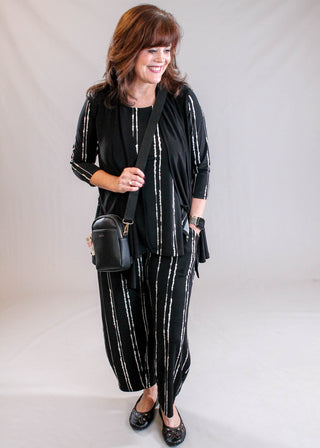 Sympli Narrow Lantern Pant in Cecily Black Print styled view - Fashion Crossroads Inc.