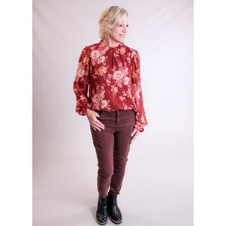 Staccato Ruffle Neck Blouse with Long Sleeves model view - Fashion Crossroads Inc