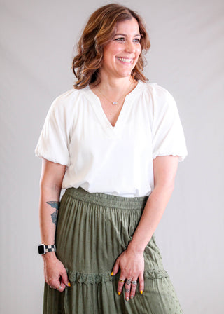 Staccato Split V Neck Top with Balloon Short Sleeves Model View - Fashion Crossroads Inc