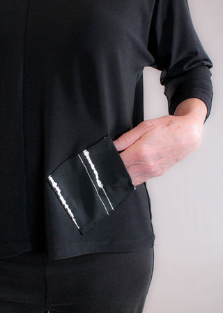 Sympli Revel Black Top with Cecily Print Pocket detail view - Fashion Crossroads Inc.